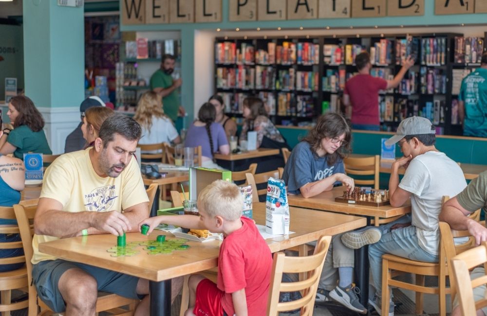 People of all ages enjoy Well Played Board Game Cafe.